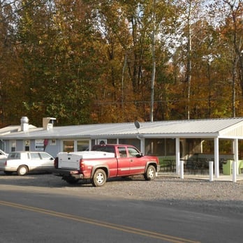 The Fishin Hole - a red truck parked in front of a white building - American Near Me - Cadiz, Kentucky The Fishin Hole - a red truck parked in front of a white building - American Near Me - Cadiz, Kentucky