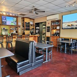 Village Grill - The booth where I sat at in front of the entrance and next to the bar.