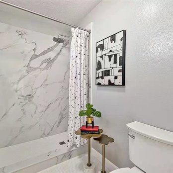 J Construction - a bathroom with a marble shower - General Contractors Near Me J Construction - a bathroom with a marble shower - General Contractors Near Me