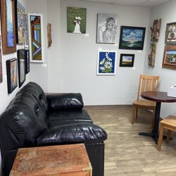 River Perk - Back room seating area - love the couch and the art on the walls.