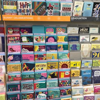 Dollar Tree - Greeting cards - Greeting cards for birthdays, graduations, and other occasions are arranged on a store rack, featuring colorful designs and messages. - Discount Store Near Me - Phoenix, Arizona