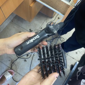 Joanna's Barbershop - My daughter holding the brush she hit me with assaulted me in front of my children! - Barbers Near Me - Bellflower, California Joanna's Barbershop - My daughter holding the brush she hit me with assaulted me in front of my children! - Barbers Near Me - Bellflower, California