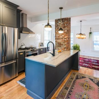 Divine Renovations - a kitchen with a brick wall and stainless steel appliances - General Contractors Near Me - Queens, New York Divine Renovations - a kitchen with a brick wall and stainless steel appliances - General Contractors Near Me - Queens, New York