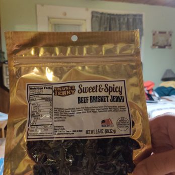 Rafter G Jerky - a hand holding a bag of sweet and spicy beef brisky jalapenos - Convenience Stores Near Me - Tombstone, Arizona