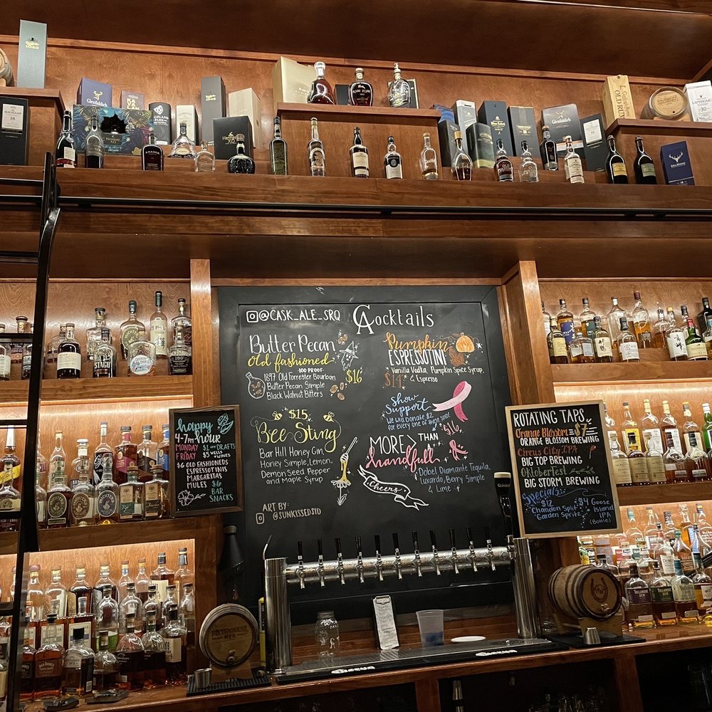 a bar with a chalk board