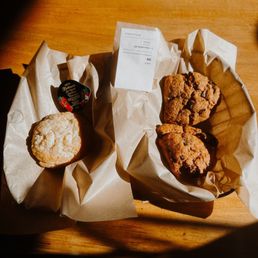 Chocolate chip scones and a biscuit with jam on the side Chocolate chip scones and a biscuit with jam on the side