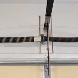Diamond Garage Doors - Obviously a broken left spring; Matt and Susan each recommended replacing both springs so they're the same age.