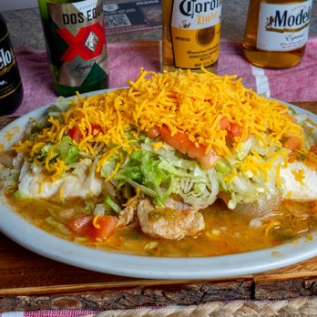 The Monterrey House - Burrito Smoothered, Lettuce, tomatoes and cheese - Tacos Near Me - Arvada, Colorado The Monterrey House - Burrito Smoothered, Lettuce, tomatoes and cheese - Tacos Near Me - Arvada, Colorado