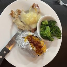Smothered chicken, baked potato and broccoli Smothered chicken, baked potato and broccoli