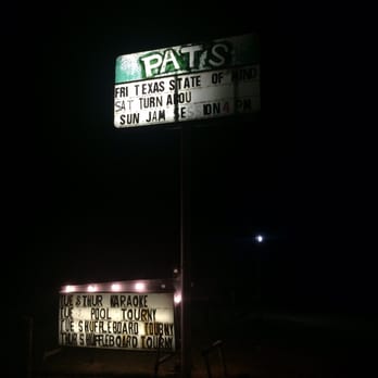 Pat's - a sign in the dark - Dive Bars Near Me - Kingsland, Texas