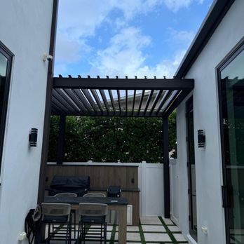 Venguard Construction - Commercial grade aluminum motorized wall mounted pergola - Black - General Contractors Near Me