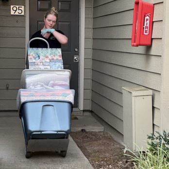 Managed Moves - Leah wheeling out a gentle load. - Movers Near Me - Portland, Oregon Managed Moves - Leah wheeling out a gentle load. - Movers Near Me - Portland, Oregon