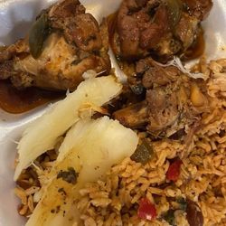 Delicias Restaurant - Half eaten lol $12 stew chicken, rice and beans, yucca