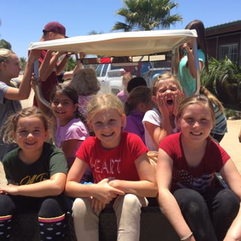 Seabreeze Farms - Margaret and camp kids going on a golf cart ride - Horse Boarding Near Me - San Diego, California Seabreeze Farms - Margaret and camp kids going on a golf cart ride - Horse Boarding Near Me - San Diego, California