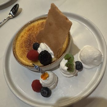 Hy's Steak House - Passion Colada Crème Brûlée ($16.00 as of 11/23/24. There was a candle b/c it was a for birthday celebration. - Steakhouses Near Me - Honolulu, Hawaii Hy's Steak House - Passion Colada Crème Brûlée ($16.00 as of 11/23/24. There was a candle b/c it was a for birthday celebration. - Steakhouses Near Me - Honolulu, Hawaii