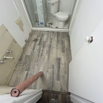 Master Tile - Bathroom floor remodel in apartment - Flooring Near Me