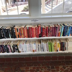 Books and Beans - The very organized book display at Books and Beans. There is another display across the room of hardbacks that you can buy.
