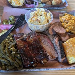 The sampler plate with ribs, brisket, and sausage. Everything was good!! The sampler plate with ribs, brisket, and sausage. Everything was good!!