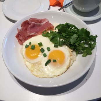 Kafe Leopold - Truffle grits with serrano ham, sunny side up eggs and arugula-- amazing.  See review.. perfect dish. - Austrian Near Me - Washington, DC, District of Columbia