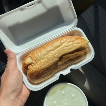 Sloopys - a person holding a sandwich in a styrofoam container - Diners Near Me - Kingsport, Tennessee