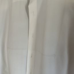 How a new shirt was returned after we took it in for pressing.