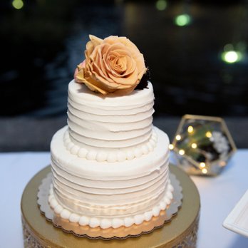 The Cakeroom - a three tiered cake with a rose on top - Cupcakes Near Me - Washington, DC, District of Columbia The Cakeroom - a three tiered cake with a rose on top - Cupcakes Near Me - Washington, DC, District of Columbia