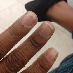 The Day Spa - My names look worse now than when I came in. Look at the cuticles and uneven nails plus bad job in just the clear polish.