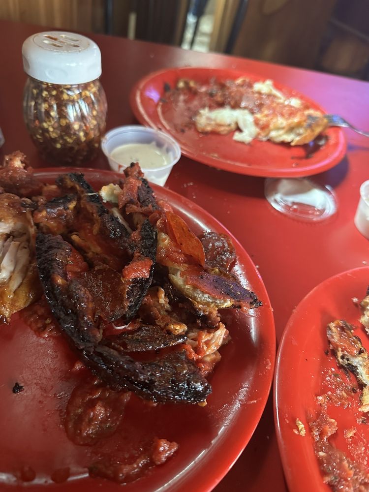 Badly burnt pizza they thought was okay to serve. Yelp