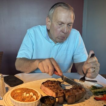 Ron Lahody's Steakhouse - My husband enjoying his "lard" meat - Steakhouses Near Me - Anderson, Indiana Ron Lahody's Steakhouse - My husband enjoying his "lard" meat - Steakhouses Near Me - Anderson, Indiana