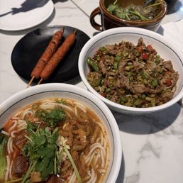 Braised beef noodles soup, pickled long bean with chicken gizzard, bbq sausage and pounded chili eggplant Braised beef noodles soup, pickled long bean with chicken gizzard, bbq sausage and pounded chili eggplant