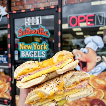 NY Bagel & Deli - a hand holding a sandwich - Breakfast & Brunch Near Me - Orlando, Florida NY Bagel & Deli - a hand holding a sandwich - Breakfast & Brunch Near Me - Orlando, Florida