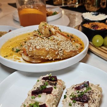 Mazi - Cast-Iron Prawns & Chicken Circassian Toast - Tapas/Small Plates Near Me - Charlotte, North Carolina Mazi - Cast-Iron Prawns & Chicken Circassian Toast - Tapas/Small Plates Near Me - Charlotte, North Carolina