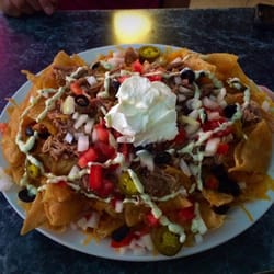The AVG Nachos. A mountain of fresh made to order chips with not so average toppings.