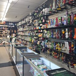 Glass pipes on the wall at Waterbeds 'n' Stuff in Heath.