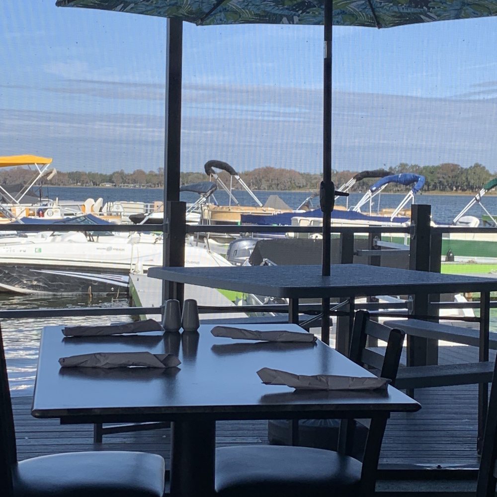 Lake Eustis Waterfront Grille - From the screened dining area, to the outside dining, to the docked boat area. - Seafood Near Me - Eustis, Florida Lake Eustis Waterfront Grille - From the screened dining area, to the outside dining, to the docked boat area. - Seafood Near Me - Eustis, Florida