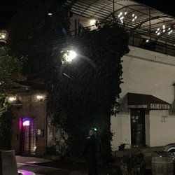Mezcalería La Penca - Entrance is in the door lit up on the left. Walk down the hallway and it will be on your left.