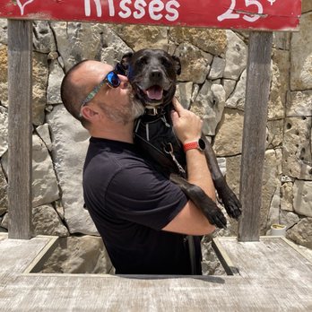Lone Man Mountain Brewing - Mandatory kissing booth photo with your dog! - Breweries Near Me - Driftwood, Texas