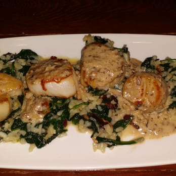 Wahoo! Grill - Seared Sea Scallops.  An absolute must try! It is complimented with sauteed spinach, bacon and a mushroom butter sauce. - Seafood Near Me - Decatur, Georgia