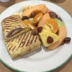 Cora - Ham and egg wrap with a side of fruit