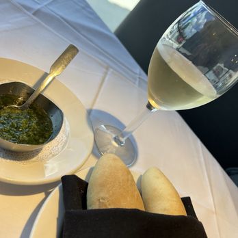 Bourbon Street Seafood Kitchen - Promising start: fresh bread and a parsley pesto? that used to have more garlic, but not this time. - Cajun/Creole Near Me - San Antonio, Texas