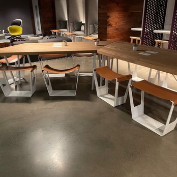 YOTEL - San Francisco - Lounge dinner table with chill chairs in the background - Hotels Near Me - San Francisco, California