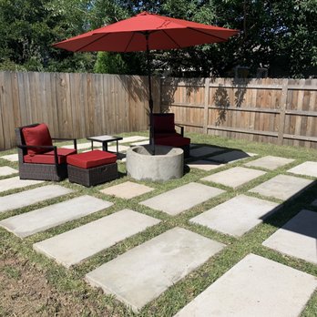 Isaias Gonzalez Landscaping - Concrete pavers and fire pit which is being used with an umbrella stand since it's too hot for a fire. - Landscaping Near Me Isaias Gonzalez Landscaping - Concrete pavers and fire pit which is being used with an umbrella stand since it's too hot for a fire. - Landscaping Near Me