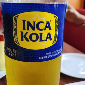 Solymar - a bottle of inca kola on a table - Peruvian Near Me - Montreal, Quebec Solymar - a bottle of inca kola on a table - Peruvian Near Me - Montreal, Quebec