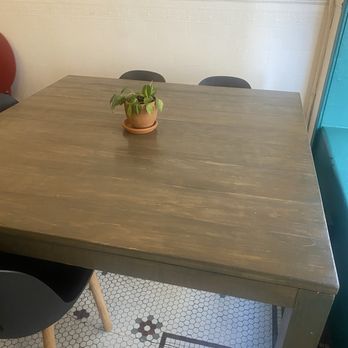Spiller Park Coffee - Cute little table and tiled floor next to a vibrant window - Coffee & Tea Near Me - Atlanta, Georgia