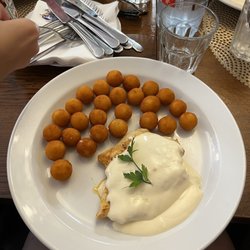 Puškin Restaurant - Chicken steak with cheese sauce and croquettes.