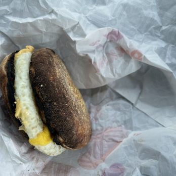Dunkin' - a breakfast sandwich on a piece of paper - Donuts Near Me - Merrimack, New Hampshire Dunkin' - a breakfast sandwich on a piece of paper - Donuts Near Me - Merrimack, New Hampshire