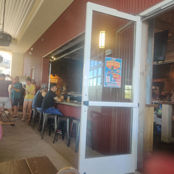 Beer Barn - Patio with fans and misting system that helps with 108 degree sunshine - Beer Bar Near Me - Gilbert, Arizona