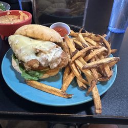 "The Reg" Breaded chicken sandwich (two honkin piece of chicken tender with melted cheese and bacon) and fries.