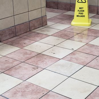 Wendy's - Water on floor and going down the hallway to the restroom area. - Fast Food Near Me - San Antonio, Texas