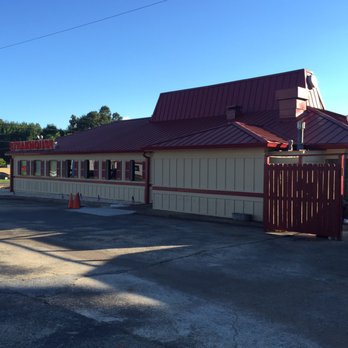 Stampede Steakhouse - Outside. This is an old "hut" Pizza Hut building - Steakhouses Near Me - Talladega, Alabama